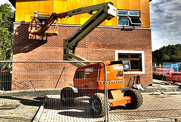 JLG cherry picker working on a commercial building